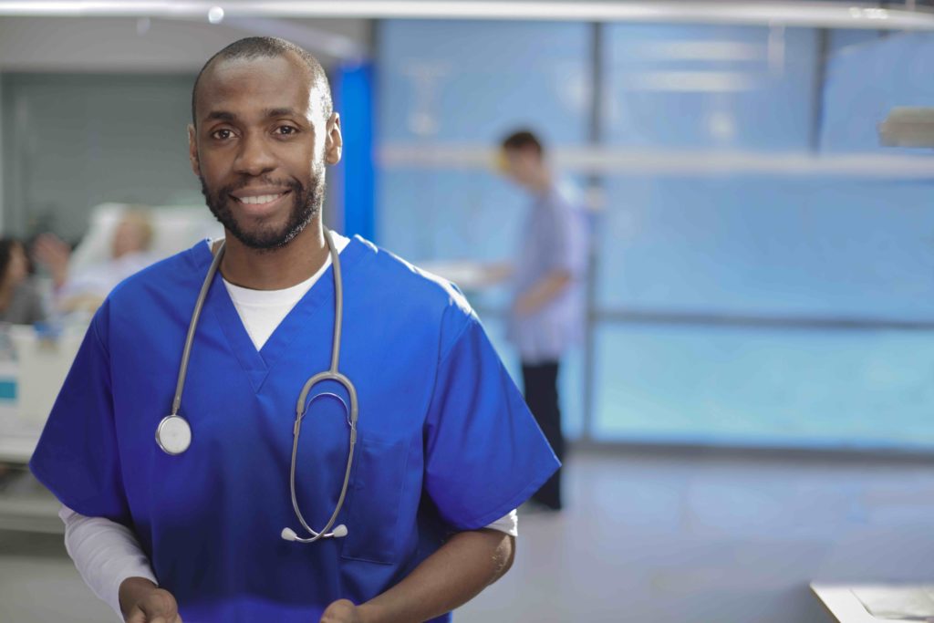 /Happy%20male%20doctor%20on%20the%20ward