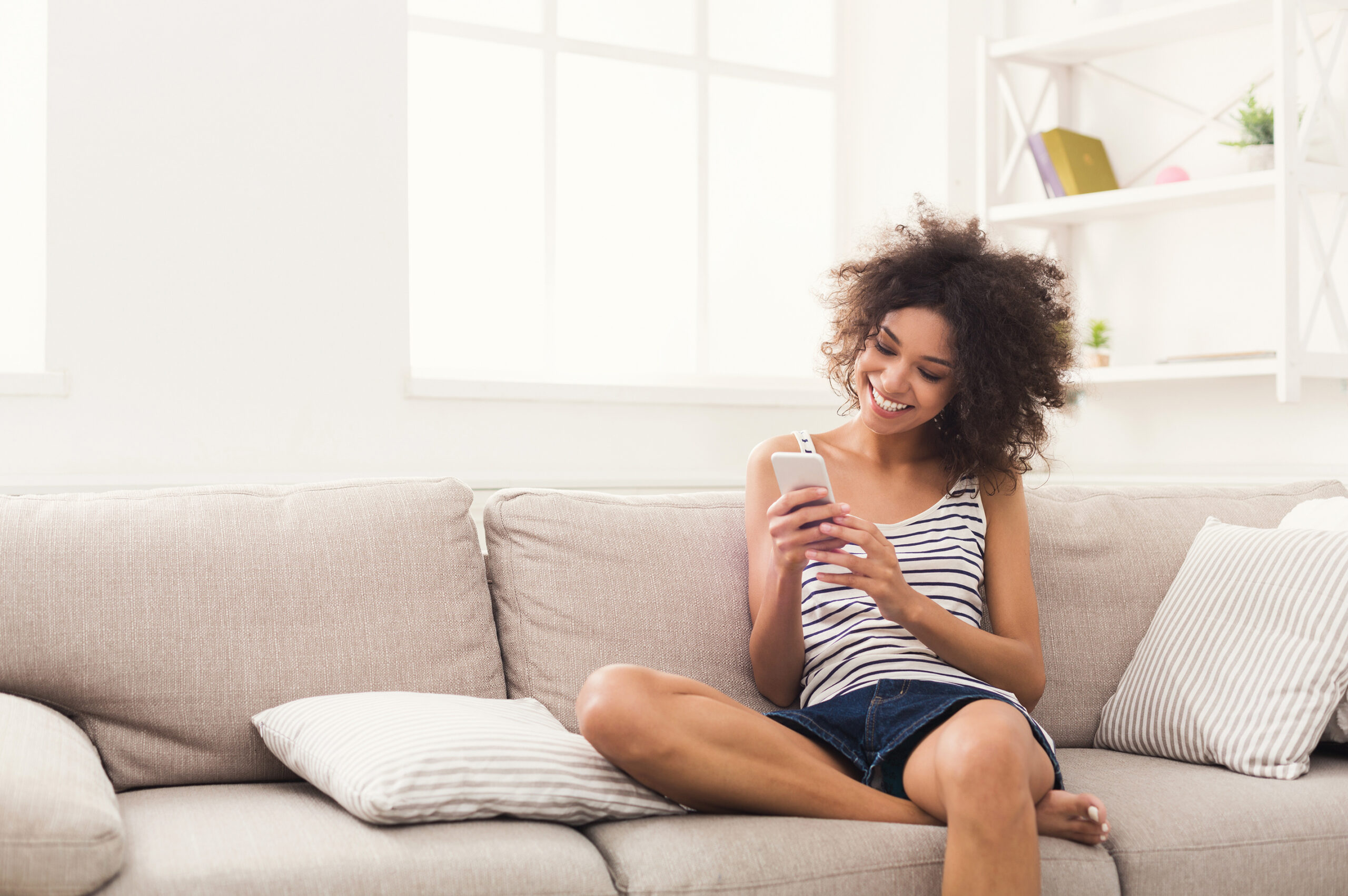 Woman uses mobile phone to connect with doctor.