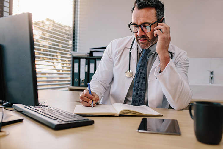 Doctor talking on the phone.